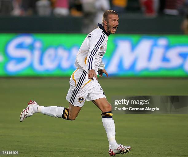David Beckham of the Los Angeles celebrates after scoring a goal during the MLS Superliga match between DC United and Los Angeles Galaxy at the Home...