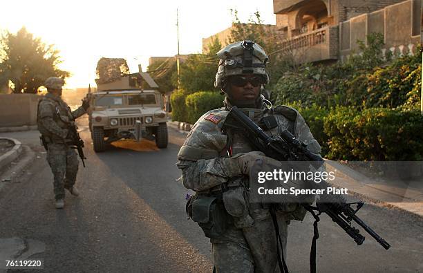 Staff Sgt. Richard Howell of Brooklyn, New York, with the U.S. Army Delta Company 212 Cavalry, patrols in the Ghazliya neighborhood, which has been...