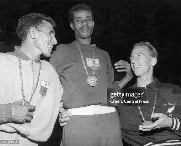 Ethiopian runner Bikila Abebe with his gold medal after winning the marathon at the 1960 Olympics in Rome, 12th September 1960. Abdeslon Rhadi of...