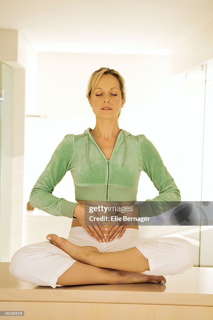 Young woman in yoga position