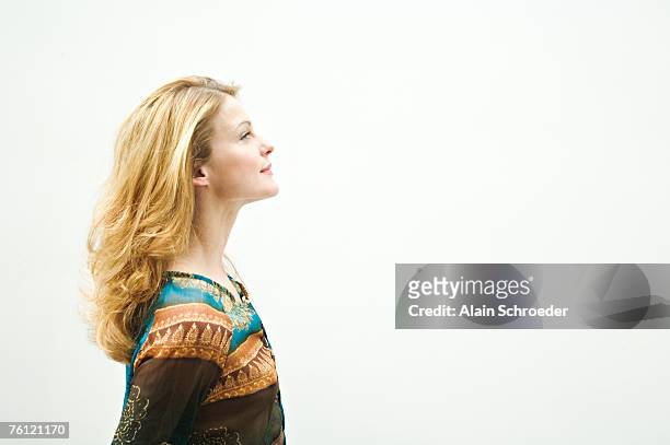 portrait of a young woman in profile - portrait profile stock pictures, royalty-free photos & images