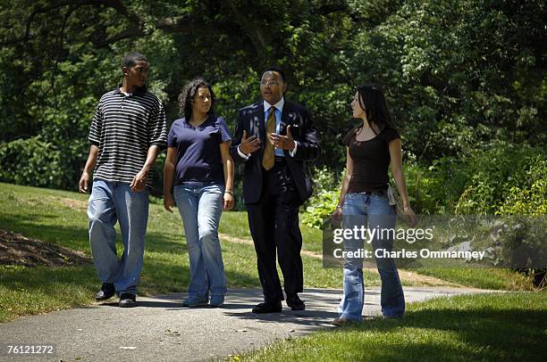 Freeman Hrabowski chats with students from the Howard Hughes Medical Institute at UMBC, where Dr. Michael Summers leads undergraduate researchers in...