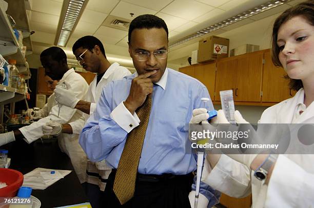 Freeman Hrabowski chats with students from the Howard Hughes Medical Institute at UMBC, where Dr. Michael Summers leads undergraduate researchers in...