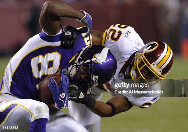 Washington Redskins cornerback Carlos Rogers tackles Minnesota Vikings wide receiver Troy Williamson on ESPN Monday Night Football September 11, 2006...