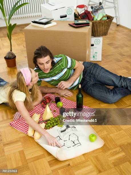 couple disussing ground plan - indoor picnic stock pictures, royalty-free photos & images