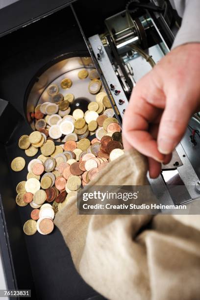 Coin Counter Background 1,002 Coin Counter Stock Photos, High-Res Pictures, and Images - Getty ...