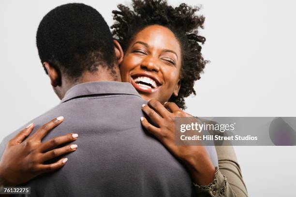 african american couple hugging - hill street studios bildbanksfoton och bilder