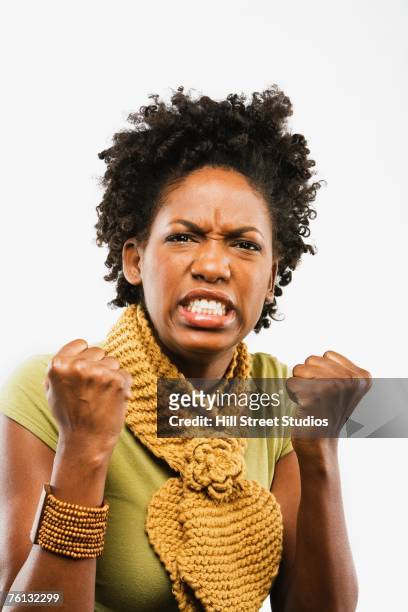 african american woman making fists - angry black woman stock pictures, royalty-free photos & images