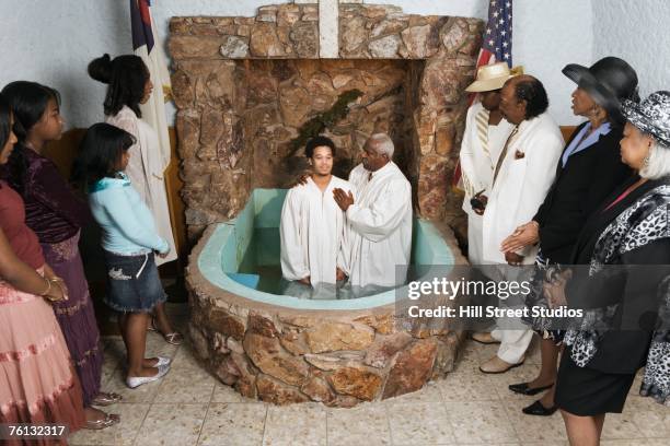 adult baptism in church - christian baptism stock pictures, royalty-free photos & images