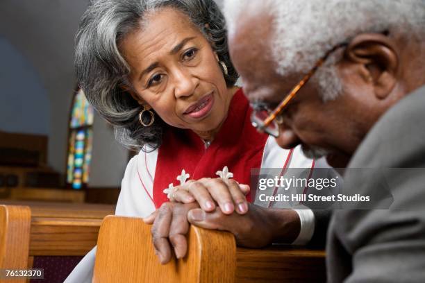 african american female reverend talking to parishioner - ministry stock pictures, royalty-free photos & images