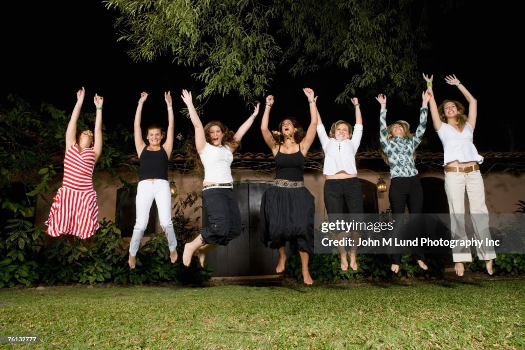 Group of Hispanic women jumping