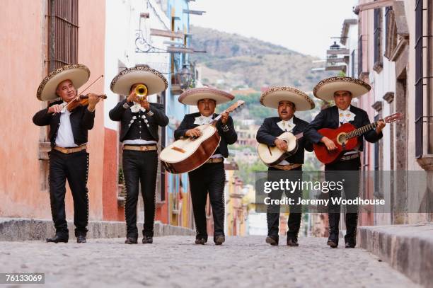 mariachi band walking in street - 民族衣装 ストックフォトと画像