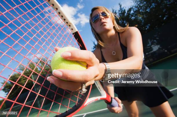 hispanic woman playing tennis - country club woman stock pictures, royalty-free photos & images