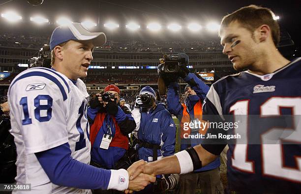 New England Patriots' Tom Brady, right, shakes hands with Indianapolis Colts' Peyton Manning after a game between New England Patriots and...