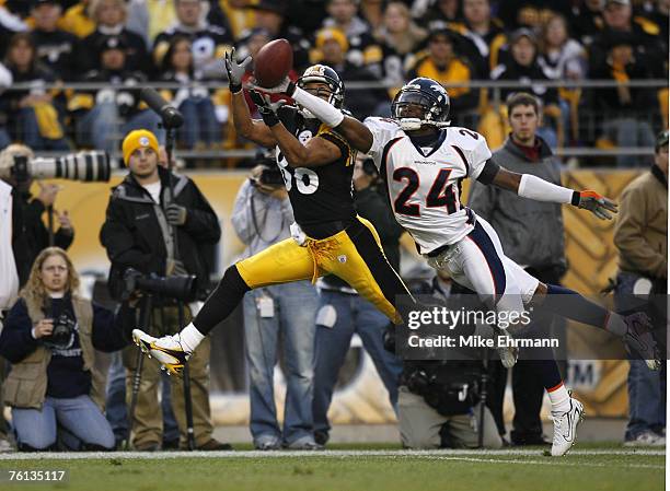 Cornerback Champ Bailey of the Denver Broncos blocks a pass against wide receiver Hines Ward during a game against the Pittsburgh Steelers at Heinz...