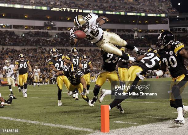 Reggie Bush of the New Orleans Saints dives into the endzone for a touchdown during a game against the Pittsburgh Steelers at Heinz Field in...