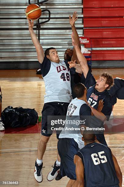 Nick Collison of the USA Basketball Men's Senior National Team puts up a shot over David Lee and Al Jefferson of the USA Basketball Mens Select Team...