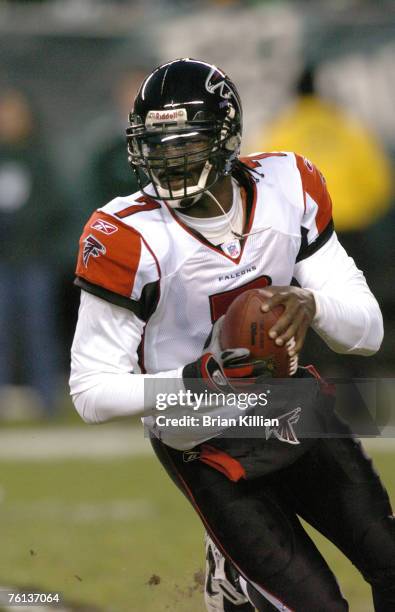 Atlanta Falcons quarterback Michael Vick runs out of the pocket against the Philadelphia Eagles at Lincoln Financial Field in Philadelphia,...