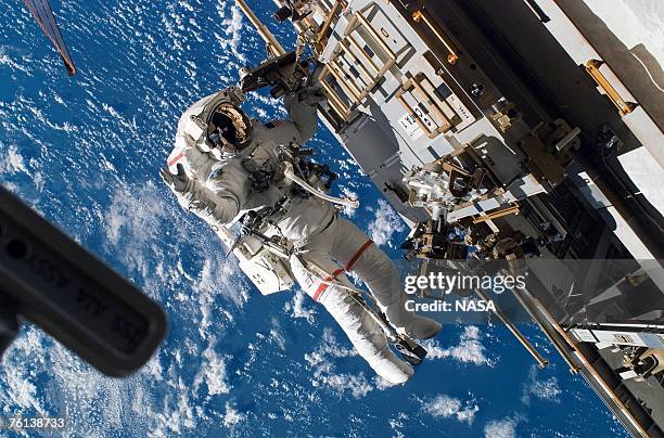 In this handout photo provided by NASA, Astronaut Rick Mastracchio, STS-118 mission specialist, participates in the mission's third planned session...