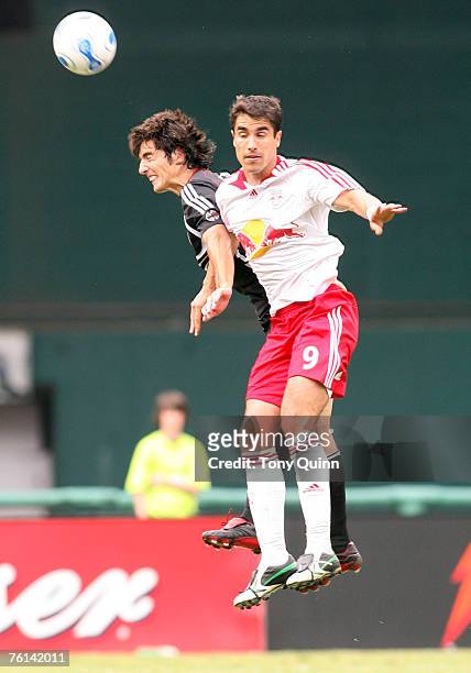 Fcundo Erpen in the air with Juan Pablo Angel. DC United trounced the New York Redbulls 4-1 behind a Ben Olsen hat trick at RFK stadium in Washington...