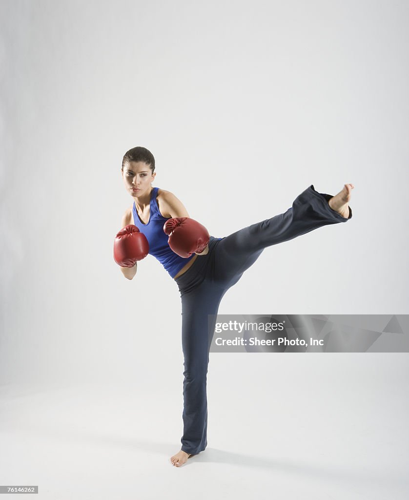 Female kick boxer, studio shot