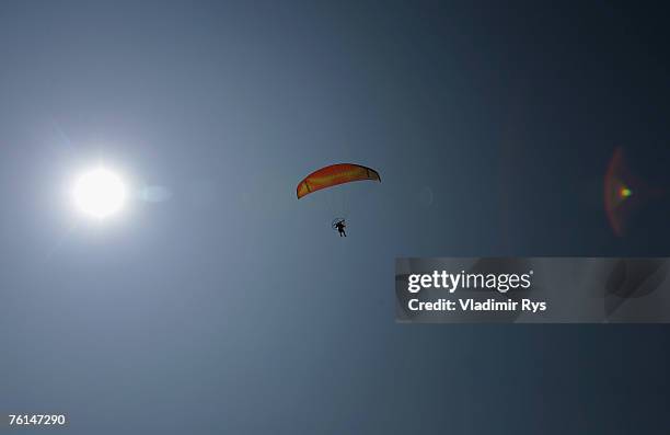 Paragliding fan flies over a beach near by Lefkada city on August 2, 2007 on Lefkada island, Greece.