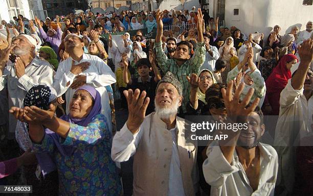 Kashmiri Muslims offer prayers on the Friday following 'Shab-e-Meraj' as the unseen head priest of the Hazratbal Shrine displays the holy relic...