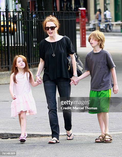 Julianne Moore sighting with her kids in the West Village, where she showed son Caleb how to use an ATM machine.