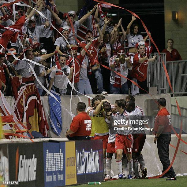 Toronto FC celebrate Maurice Edu's goal during the second half of a soccer game against the Chicago Fire at Toyota Park in Bridgeview, Ill. On...