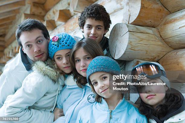 "young friends in ski clothes, portrait" - girl face hat raincoat stock pictures, royalty-free photos & images