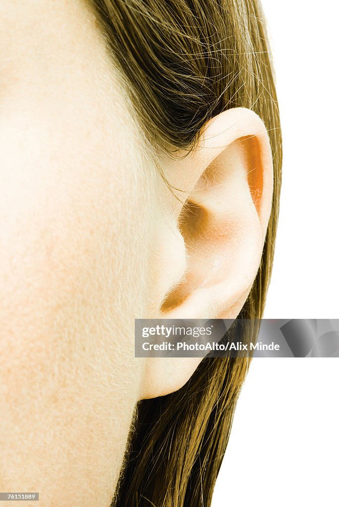 "Teenage girl's ear, extreme close-up"