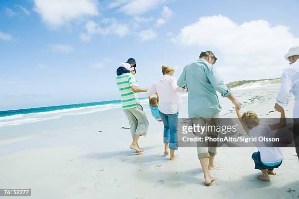 family on beach - family no faces stockfoto's en -beelden