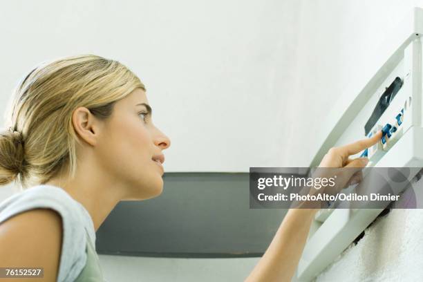 woman looking at fuse box - fuse box stock pictures, royalty-free photos & images