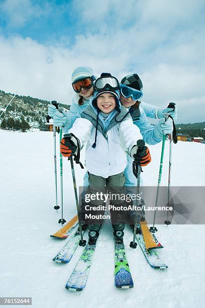 "young skiers, full length portrait" - family sport winter stock-fotos und bilder
