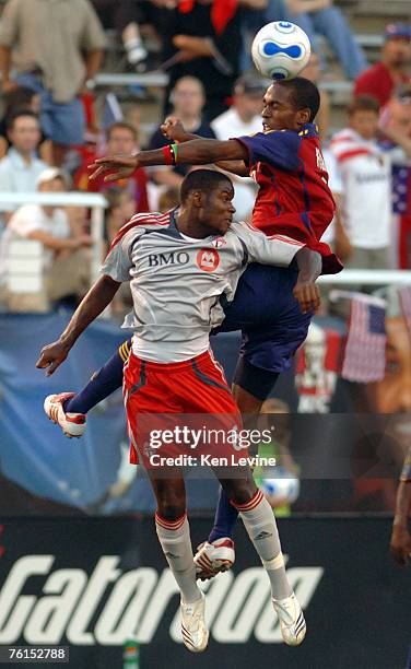 Real Salt Lakes Atiba Harris heads the ball against Toronto FCs' Maurice Edu at Rice-Eccles Stadium in Salt Lake City, Utah, Wednesday, July 4 ,...