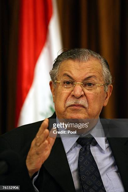 Iraqi President Jalal Talabani speaks at the signing ceremony of a three page agreement on a new alliance of moderate Shiites and Kurds at a meeting...