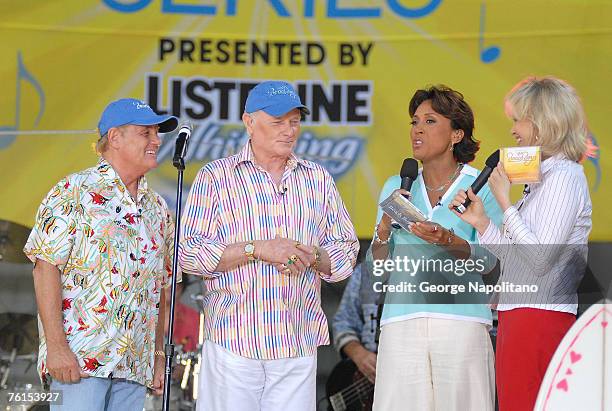 Beach Boy members Bruce Johnston and Mike Love give a copy of their new CD to Robin Roberts and Diane Sawyer during the "Good Morning America"...