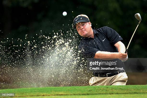 Carl Pettersson of Sweden hits from a bunker along the 16th green during the second round of the Wyndham Championship at Forest Oaks Country Club on...