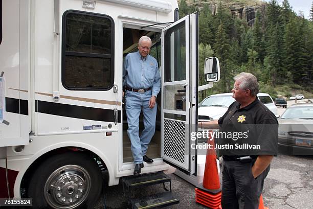 Emery County sheriff LaMar Ruymon holds the door open for U.S. Sen. Orrin Hatch as he prepares to speak to reporters about the recent collapse at the...