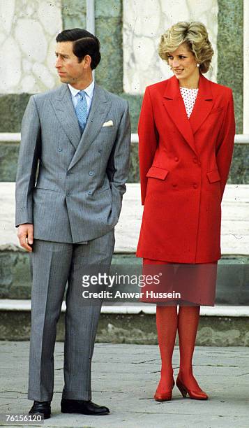 Prince Charles, Prince of Wales and Diana, Princess of Wales, wearing a red suit designed by Japer Conran with a red and white polka dot top, red...