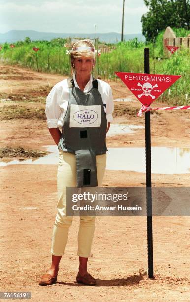 Diana, Princess of Wales, walks with body armour and a visor on the minefields during a visit to Huambo, Angola on January 15, 1997.