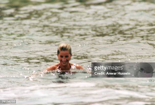 Diana, Princess of Wales, smiles as she swims in the sea while on holiday in Saint-Tropez on July 17, 1997 in Saint-Tropez, France.