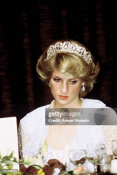 Diana, Princess of Wales, wearing a pale blue dress with polka dots designed by Elizabeth and David Emanuel and the Spencer family tiara, attends a...