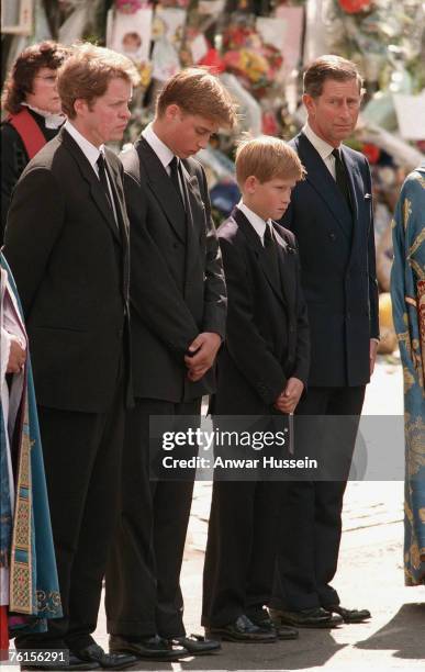 Earl Spencer, Prince William, Prince Harry and Prince Charles follow the coffin to the funeral of Diana, Princess of Wales on September 6, 1997 in...