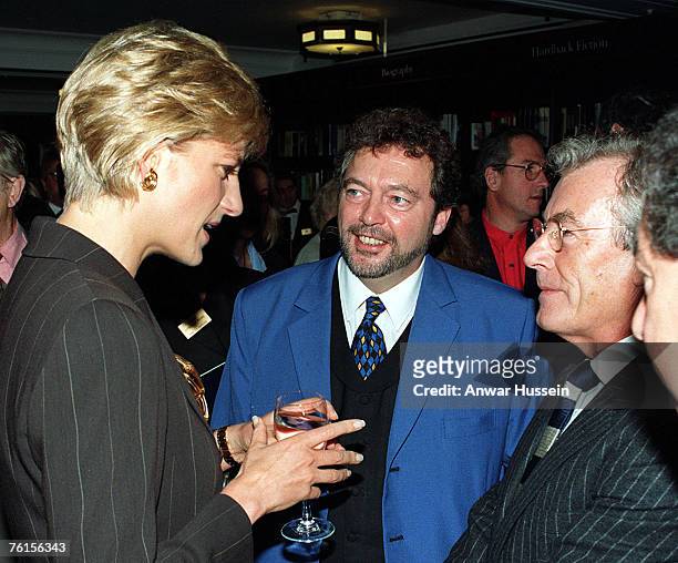 Diana, The Princess of Wales talking to TV presenter Jeremy Beadle and photographer to the stars Terry O'Neill, at Harrods book department today ,...