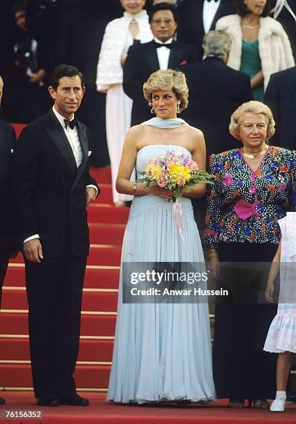 Prince Charles, Prince of Wales and Diana, Princess of Wales, wearing a pale blue silk chiffon strapless dress with a matching chiffon stole designed...