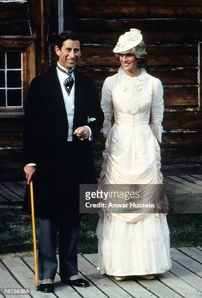 Prince Charles, Prince of Wales and Diana, Princess of Wales, wearing traditional Klondike style outfits, attend a Klondike evening barbeque on June...