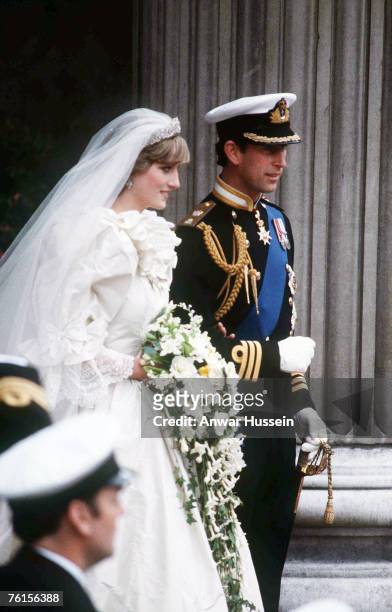 Prince Charles, Prince of Wales and Diana, Princess of Wales, wearing a wedding dress designed by David and Elizabeth Emanuel and the Spencer family...