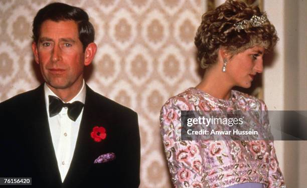 Prince Charles, Prince of Wales and Diana, Princess of Wales, wearing a mauve sheaf dress designed by Catherine Walker with a bolero of embroidered...