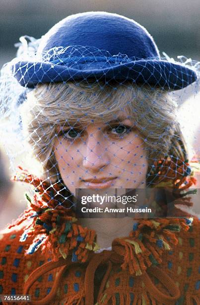 Diana, Princess of Wales, wearing a red coat designed by Bellville Sassoon and a John Boyd hat, during a visit to Wrexham on November 26, 1982 in...